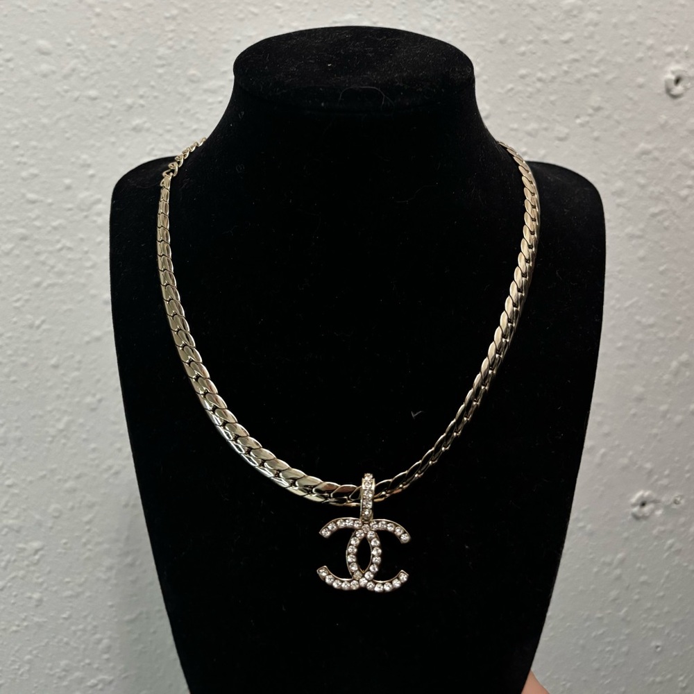CHANEL Silver Necklace with Crystal Logo Pendant